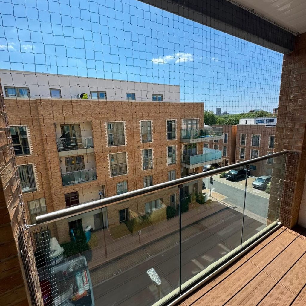 An office with bird netting on the balcony